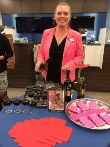 A lovely BMO employee helps serve the wine during the recent Chocolate & Wine Pairing event in Winnipeg.