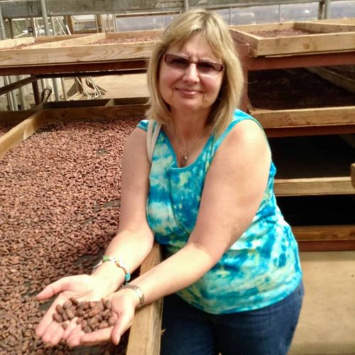 Doreen examing cacao beans in Hawaii.