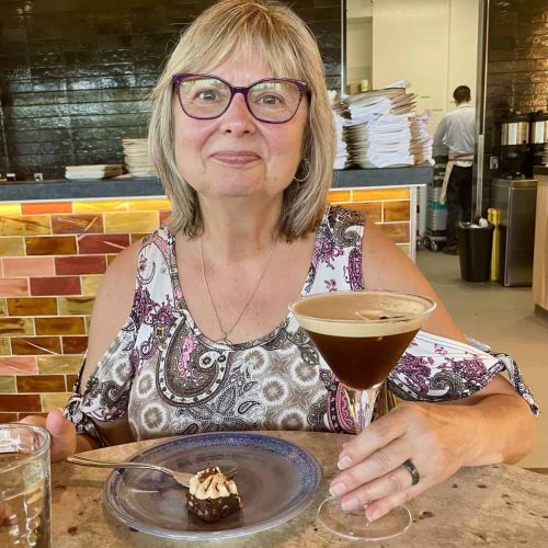 Doreen is researching all things chocolate, shown here with a delicious chocolate martini and chocolate cake in Winnipeg.