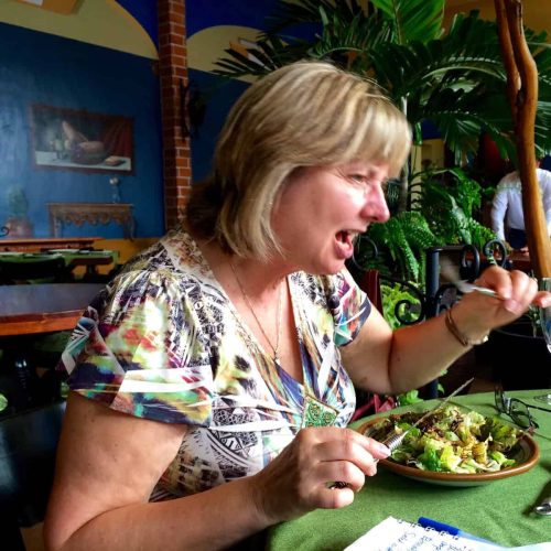 It's not all glamour! Doreen is shown here in Mexico eating grubs and fried grasshoppers in a dish served with cacao nibs.